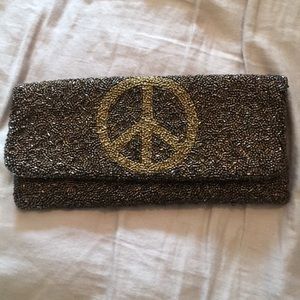 Foldable brown beaded clutch w/ peace sign